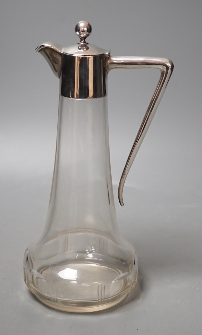 A German white metal mounted glass liqueur jug, 24.6cm.